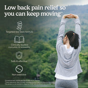 Woman stretching overhead to support low back pain relief while staying active