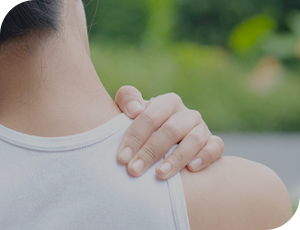 A person holds their shoulder